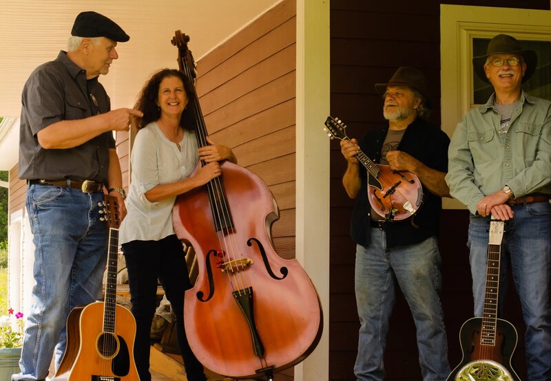 Rock Salt & Nails on a porch, with instruments